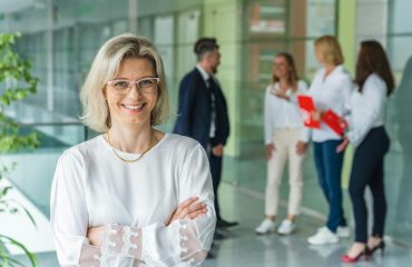 photo of a woman wearing eyeglasses and a white blouse